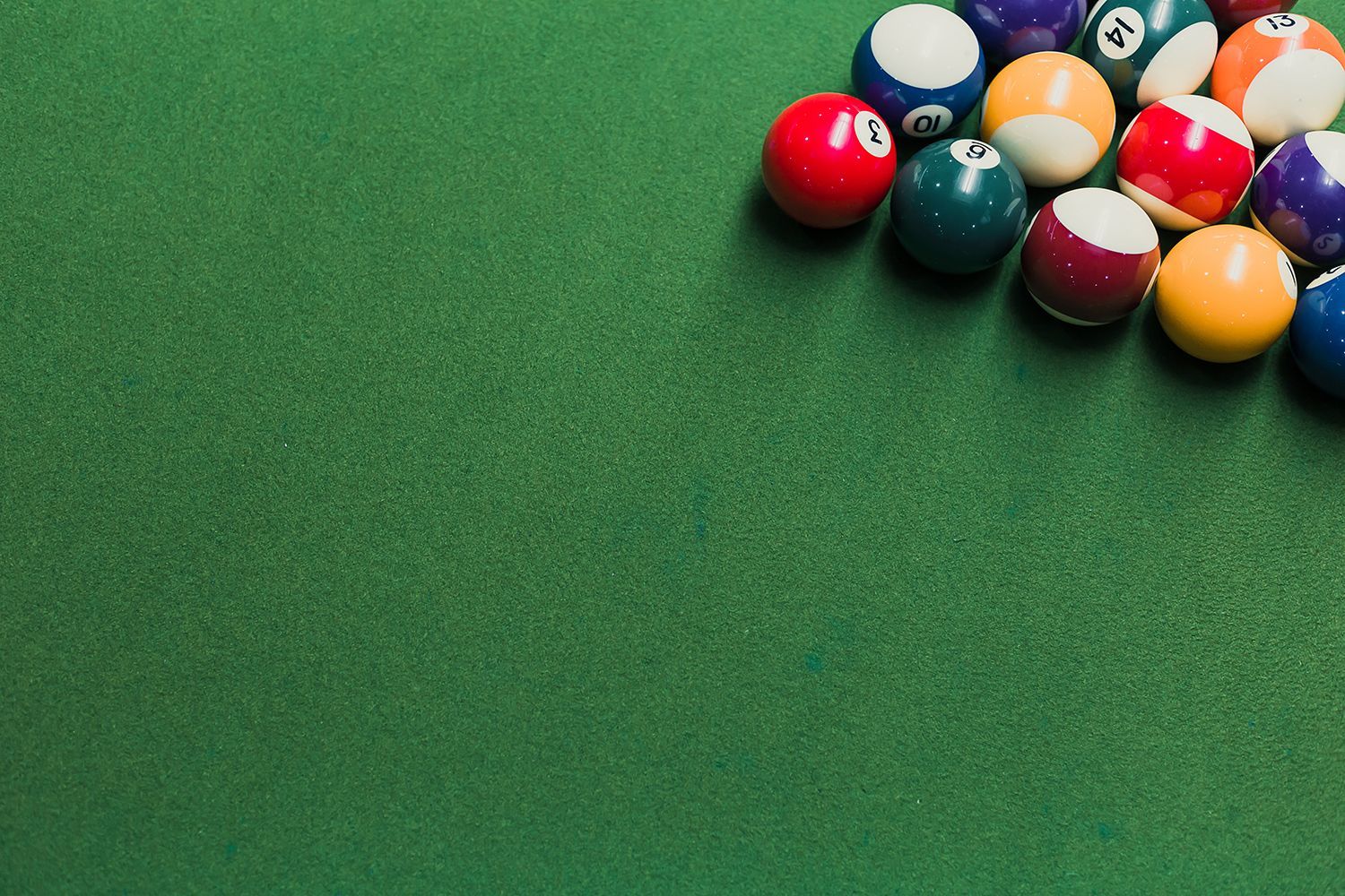 Close-up of snooker balls on a green table with setup positions