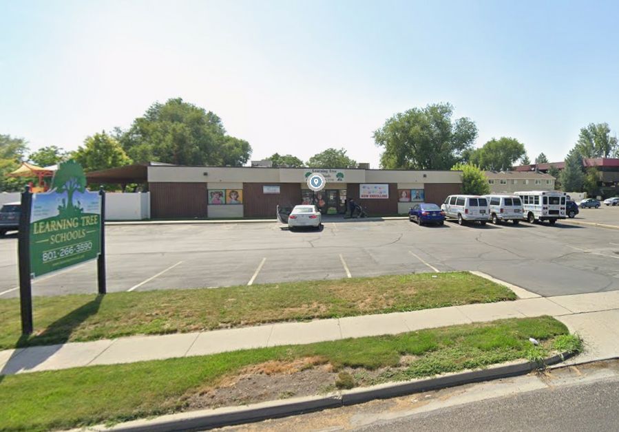 Learning Tree preschool building with a parking lot and sign.