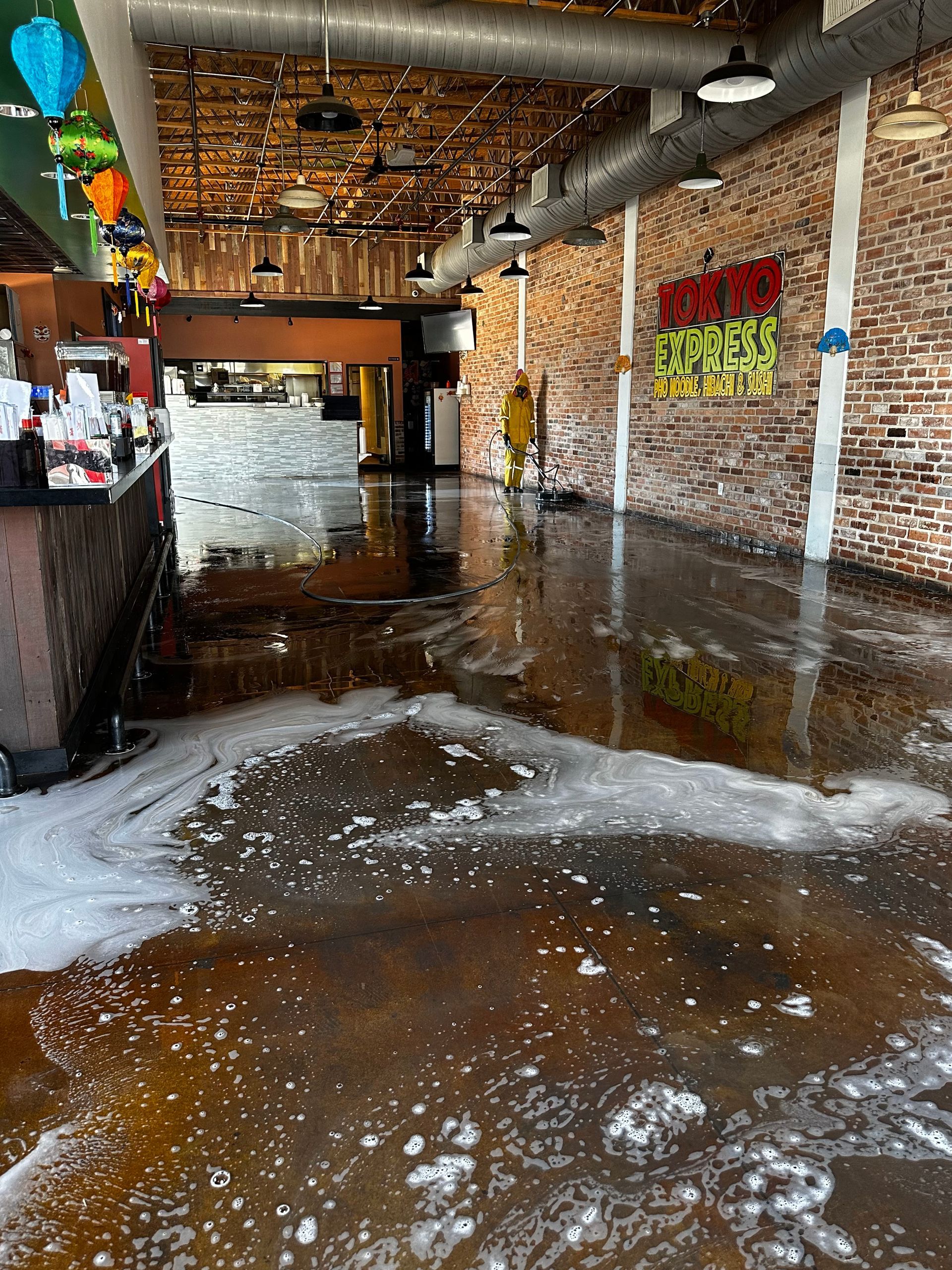 a restaurant with a lot of water on the floor .