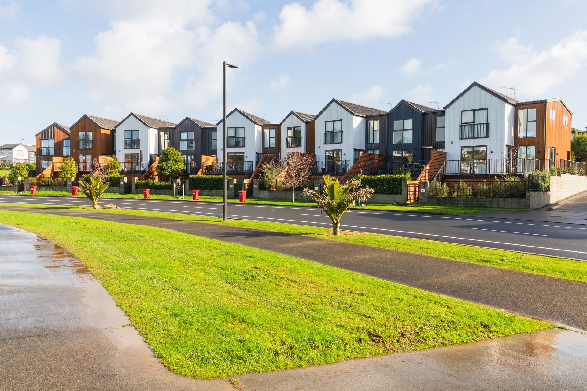 A row of houses are lined up next to each other in a residential area.