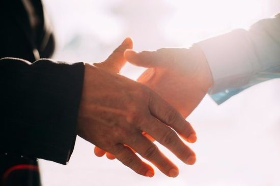 two men shaking hands