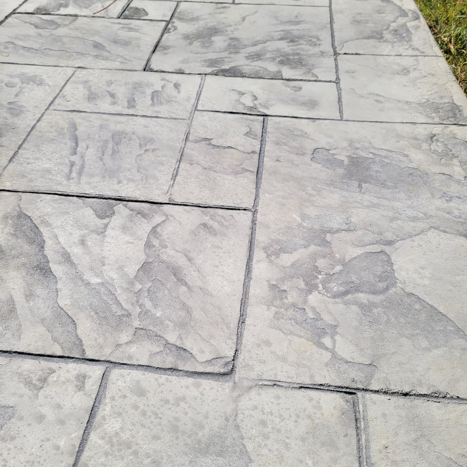 footpath paved with diamond shaped concrete tiles