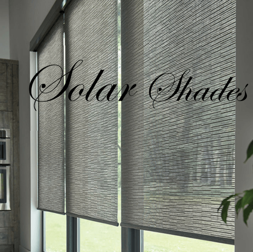 Solar shades in a window, gray and textured. Interior shot of a kitchen.
