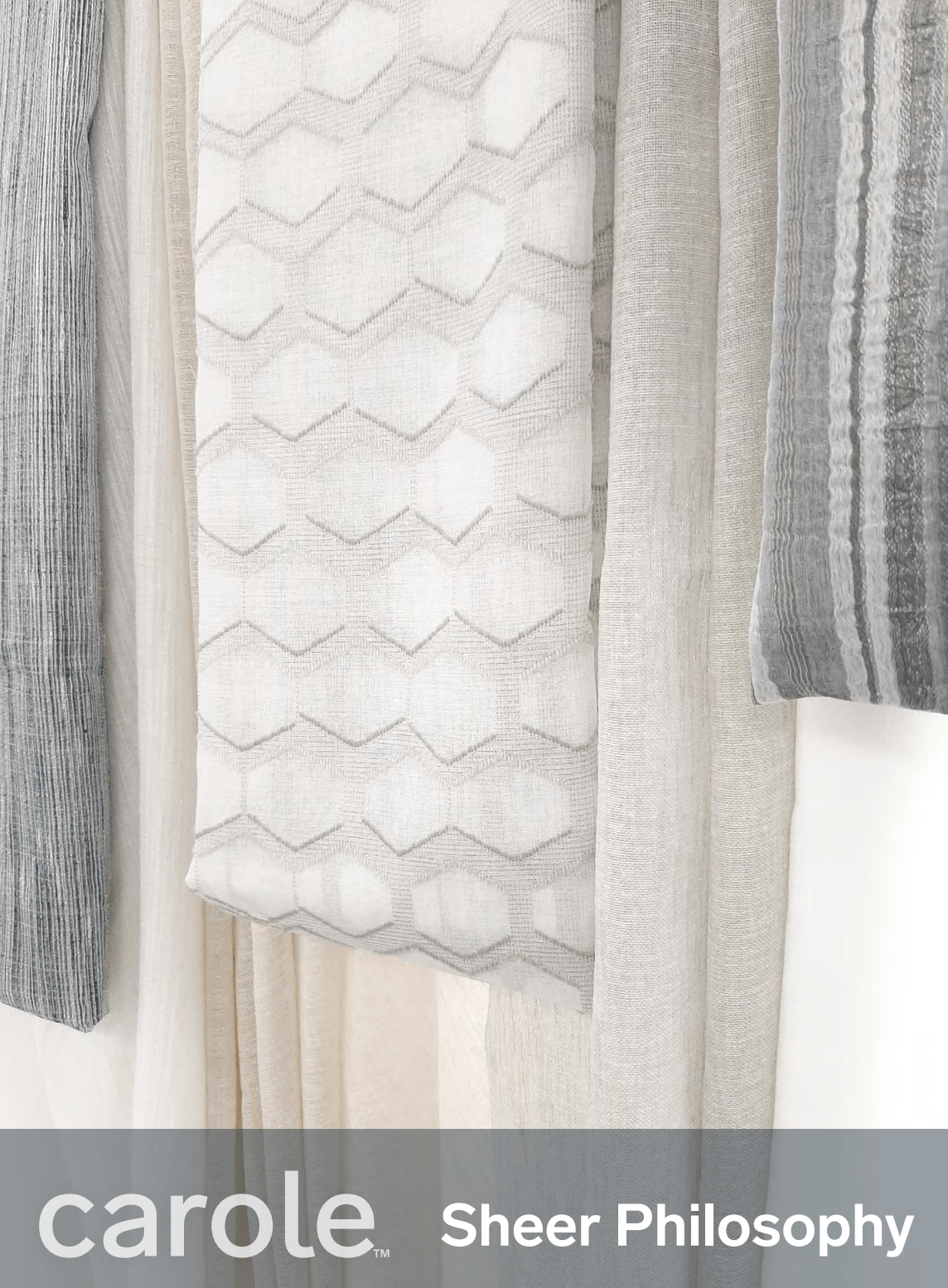 Close-up of gray and white sheer fabric samples for curtains; 