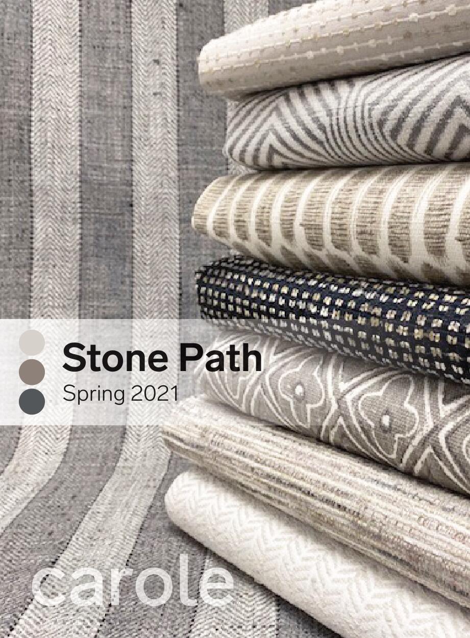 Stack of fabric swatches in neutral tones. 