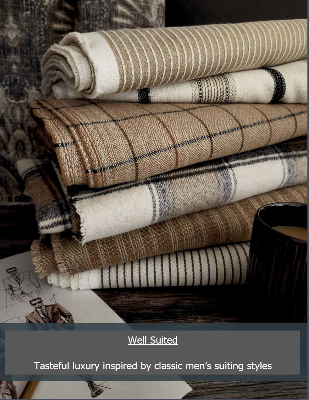 Pile of patterned tan, cream and black fabric rolls. 