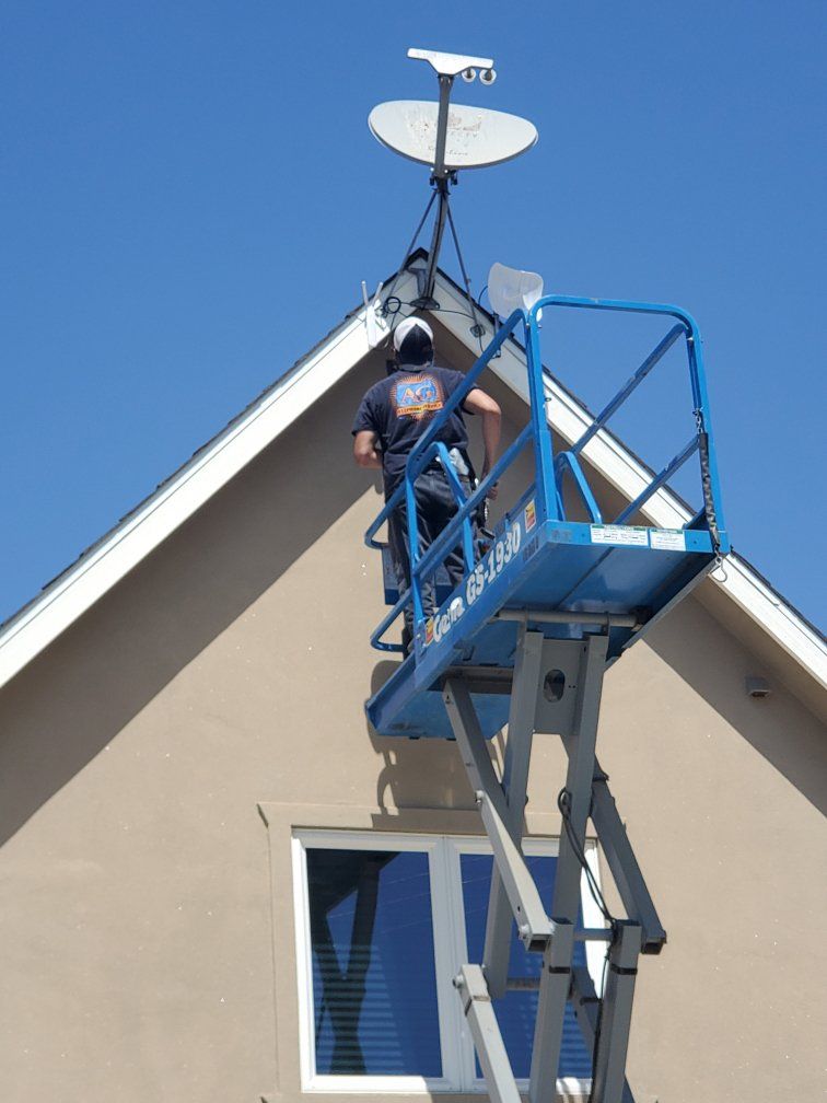 Man Checking the Wires | Porterville, CA | A & G Telephone Service Inc