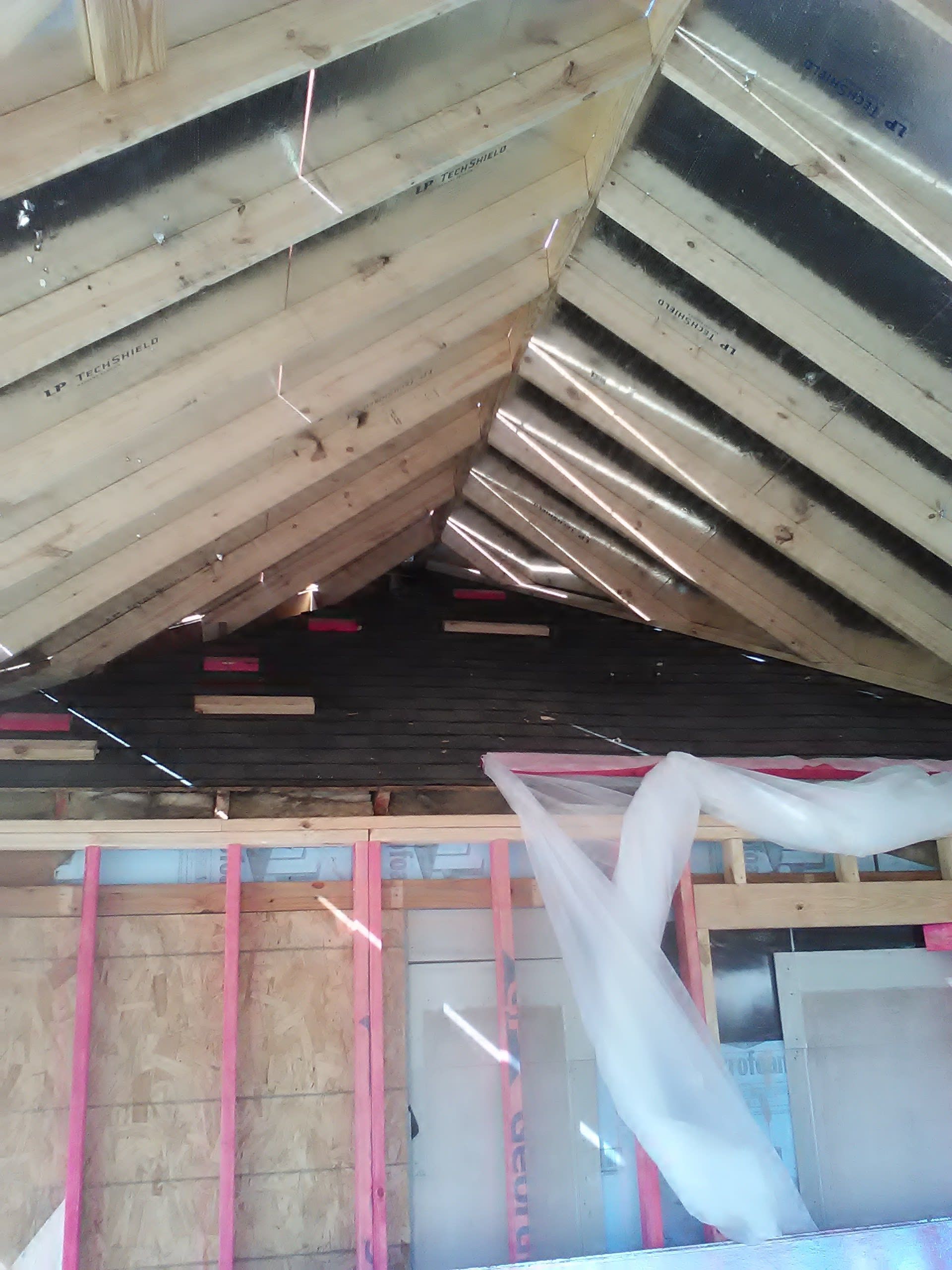 Interior view of a partially constructed roof structure