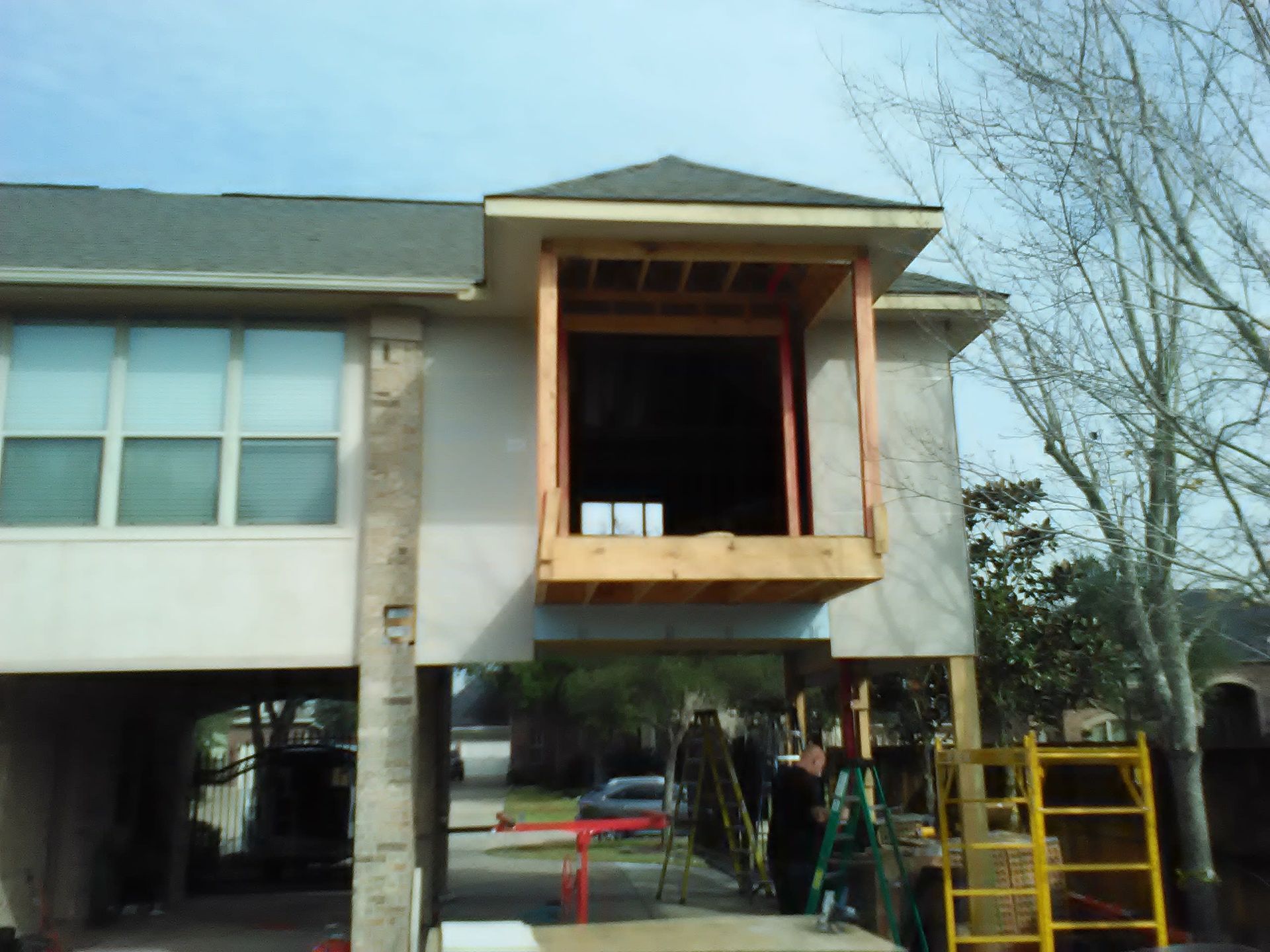 House under construction with a wooden framed balcony