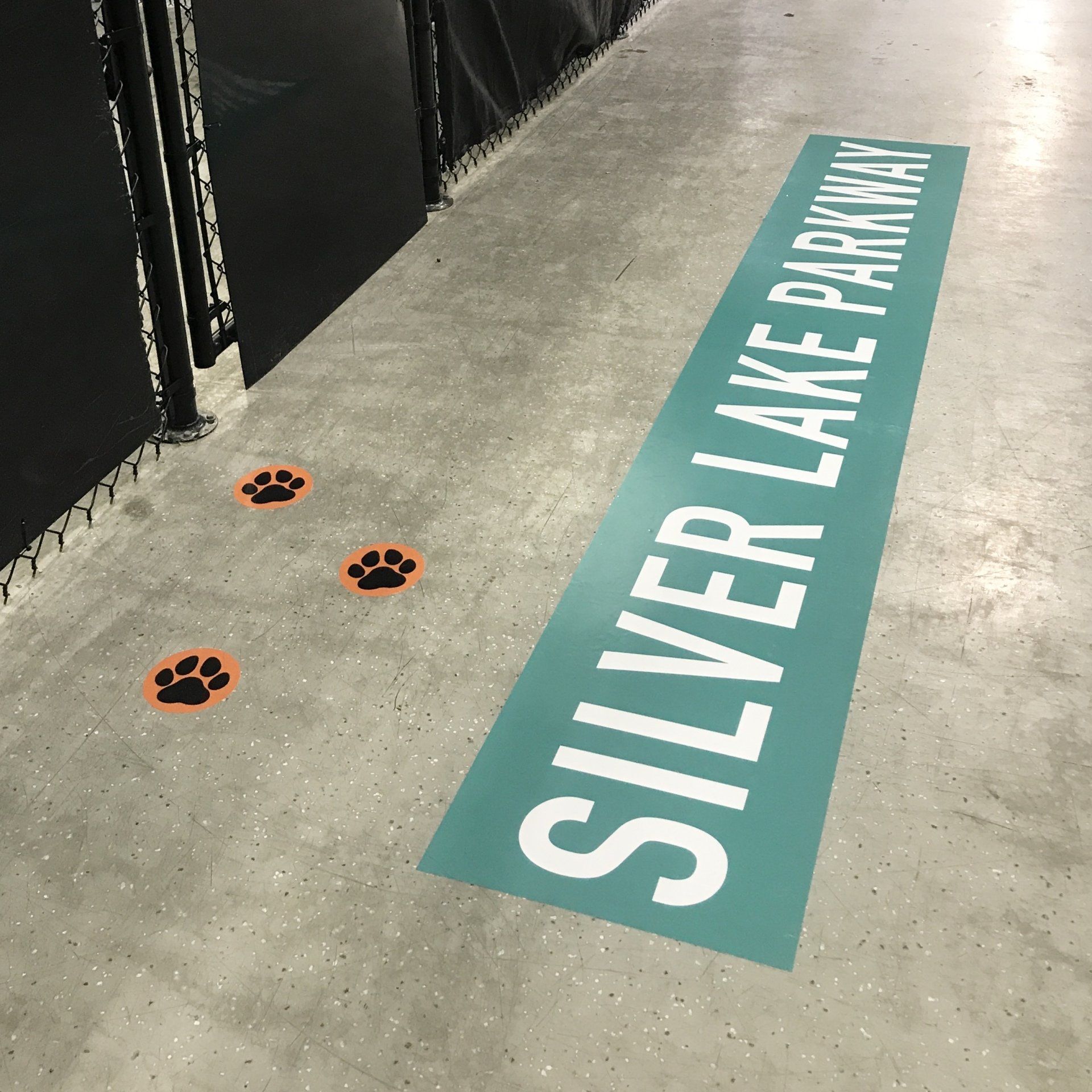 A sign on the floor that says silver lake parkway