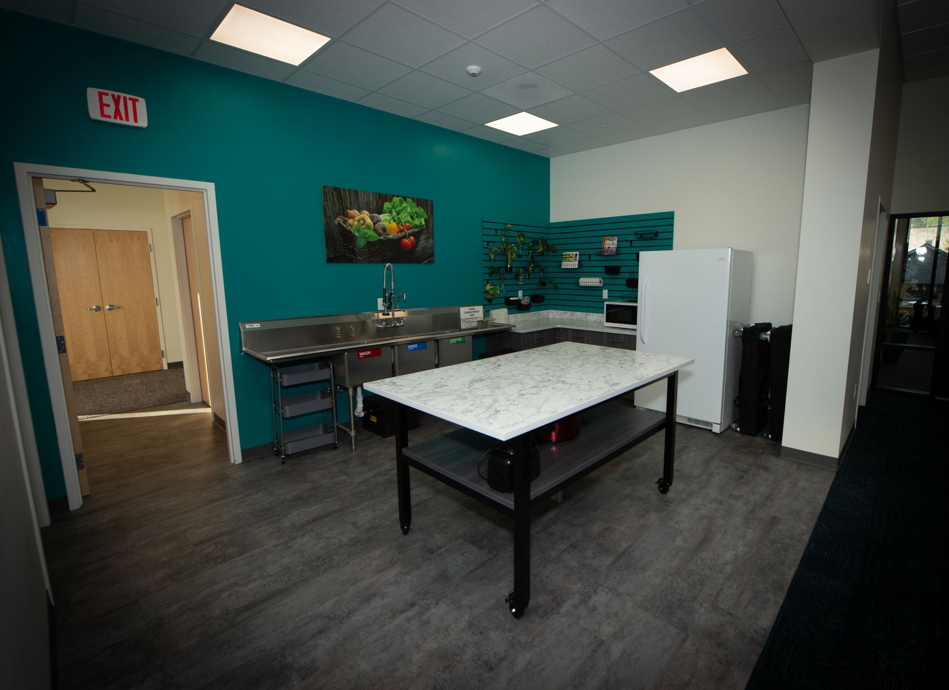 There is a large table in the middle of the room.