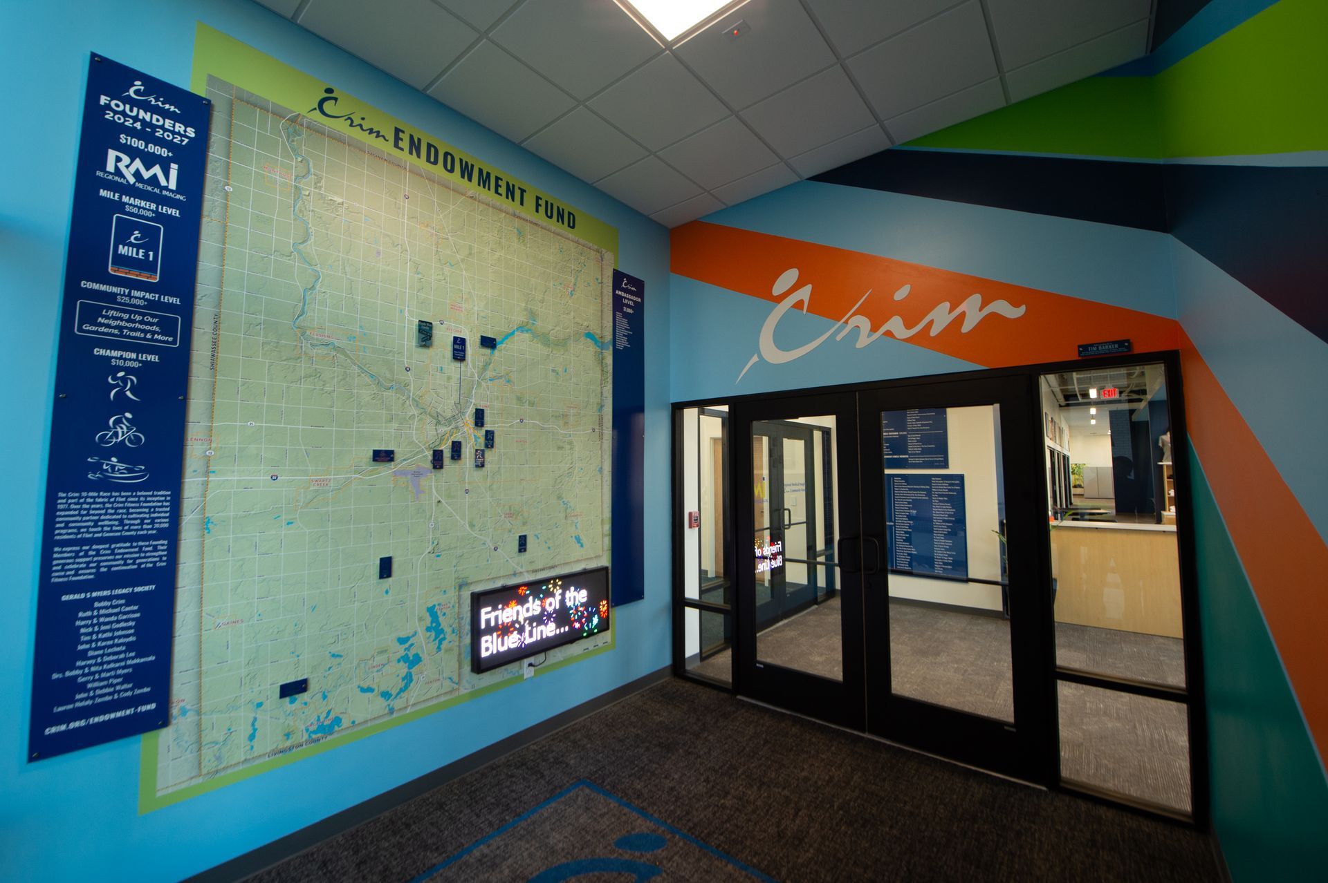 A large map on a wall with the word crisis on it