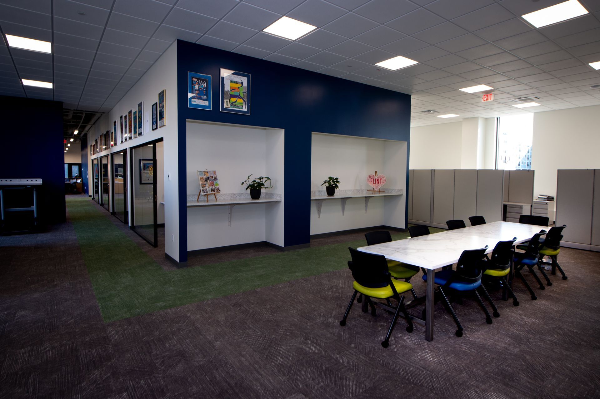 A large room with a table and chairs in it