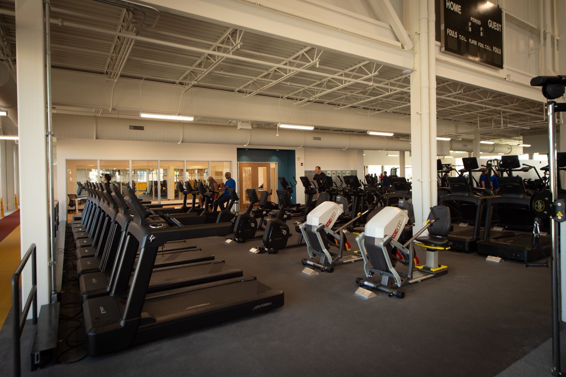 A gym with a lot of treadmills and exercise bikes.