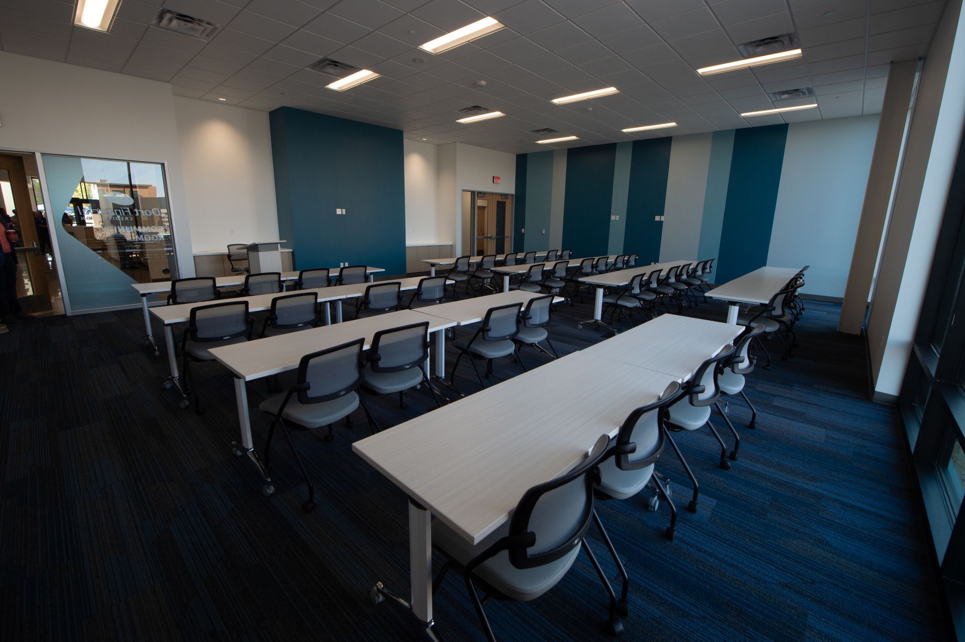 A large room with tables and chairs in it