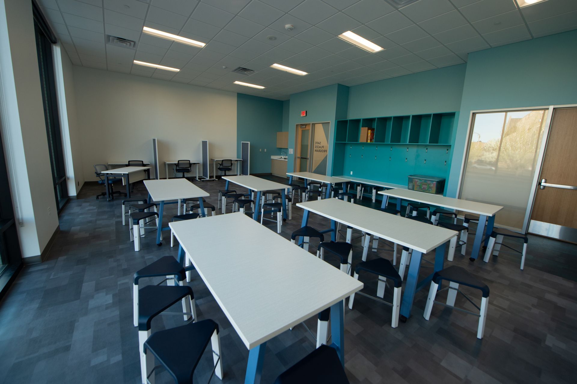 A large room with tables and chairs in it