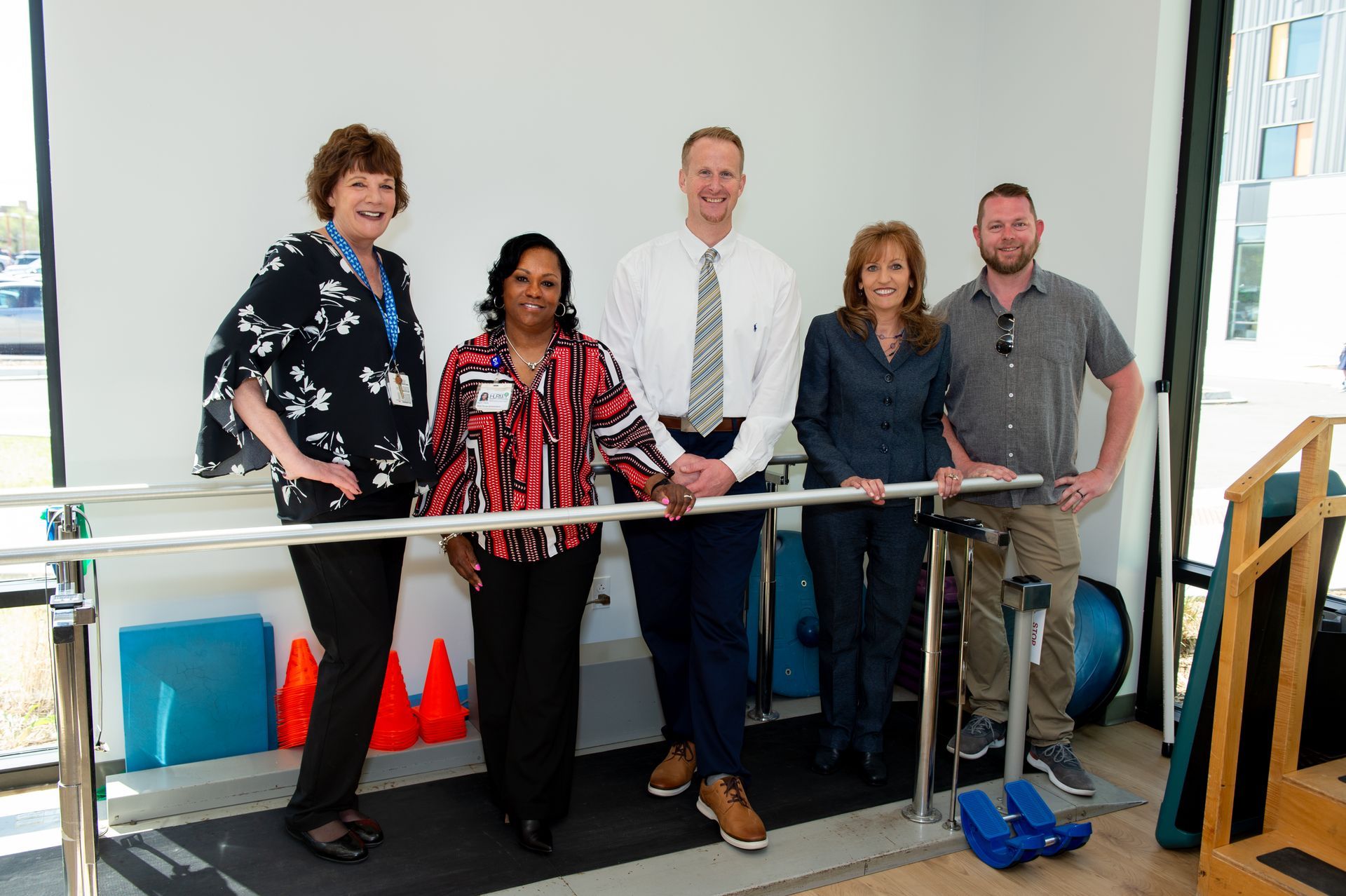 A group of people standing next to each other in a room.