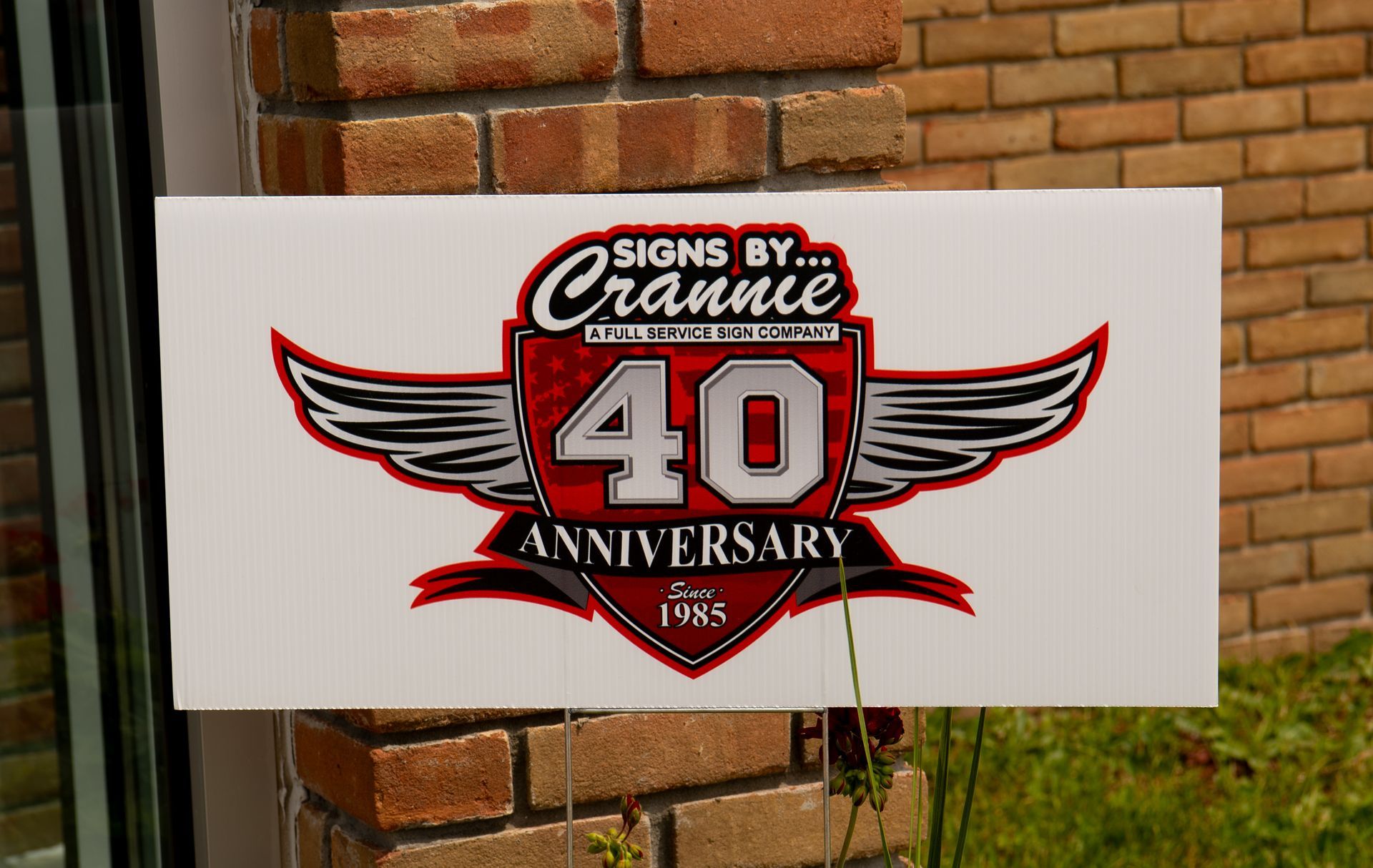 A sign that says signs by crannie 40 anniversary
