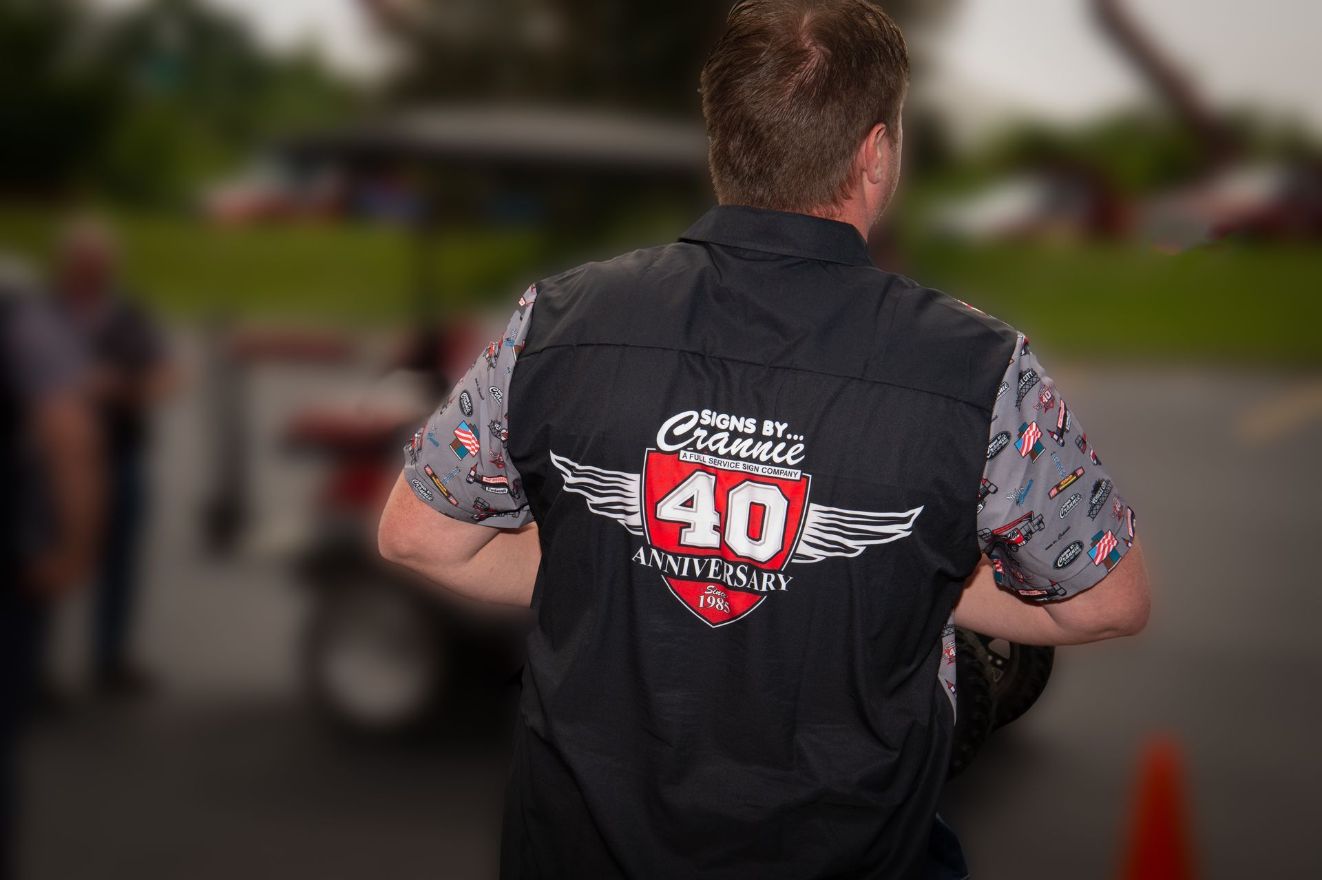 A man wearing a black vest with the number 40 on it