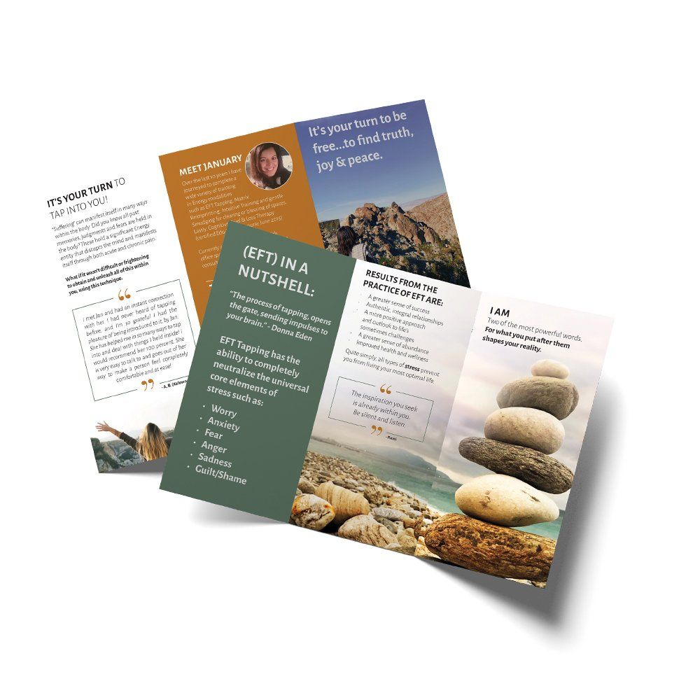 Three brochures are stacked on top of each other on a white surface.
