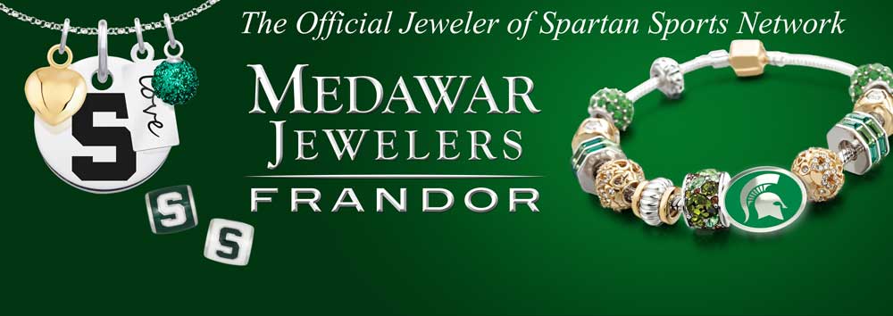 A necklace and bracelet from medawar jewelers on a green background