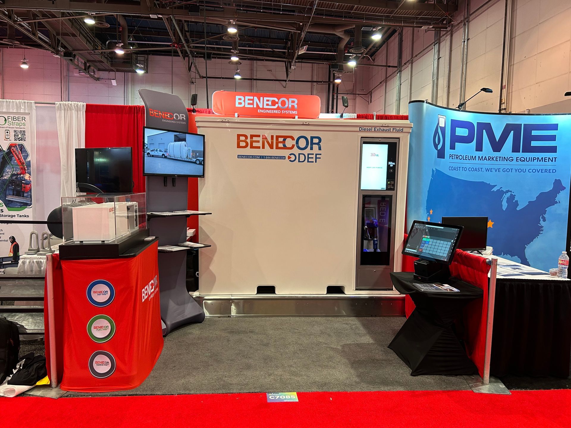 A booth at a trade show with a sign that says pme