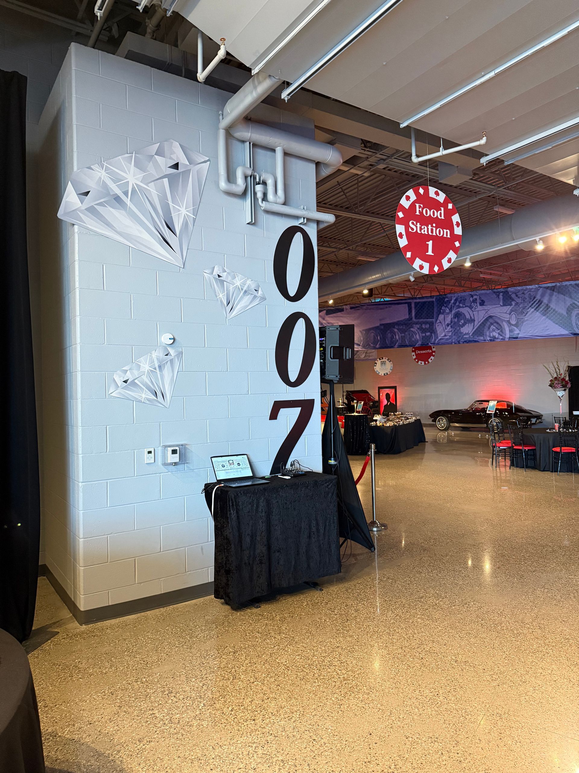 A large room with a brick wall and a table in front of it.