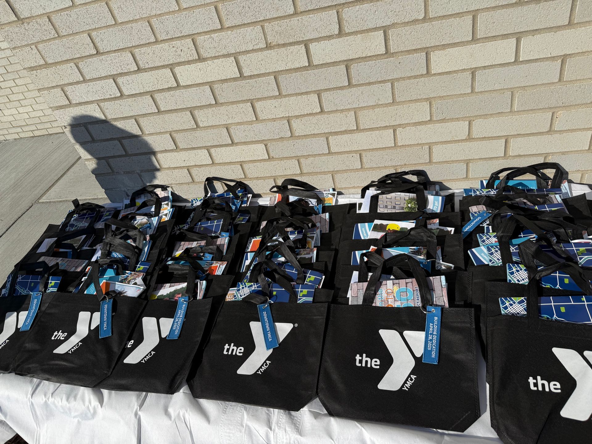 A table with a bunch of bags that say the y on them