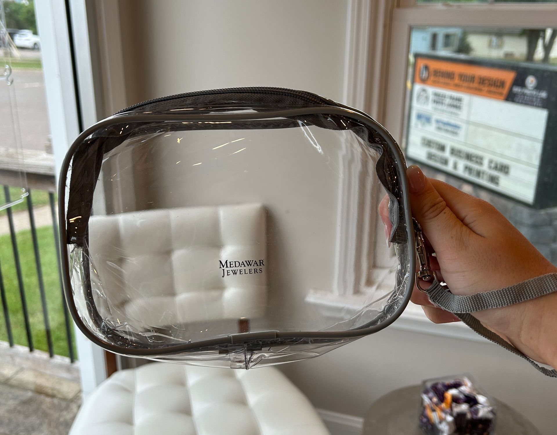 photo of a clear pouch with the Medawar Jewelers logo on it