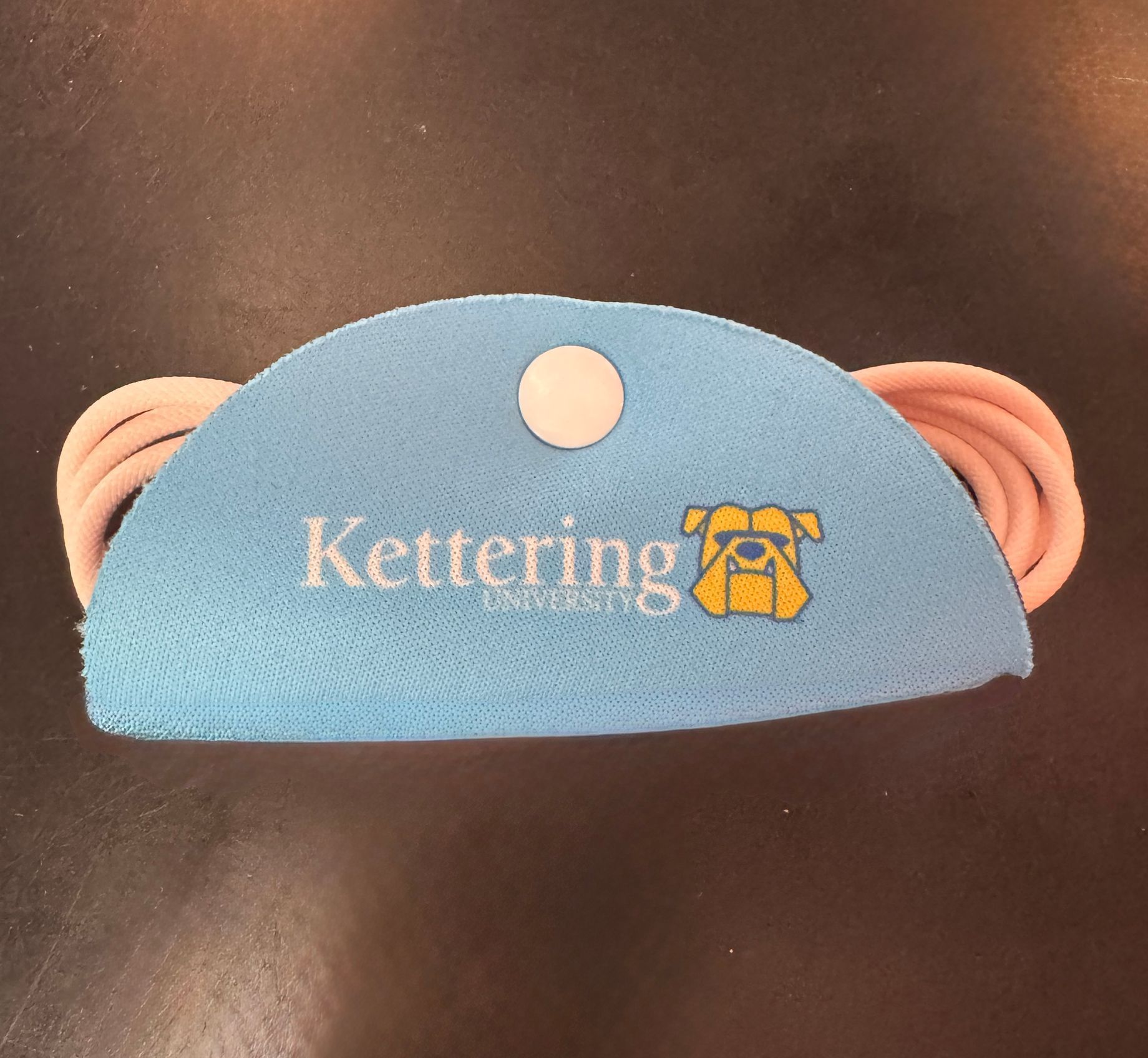 A blue item with the word kettering on it