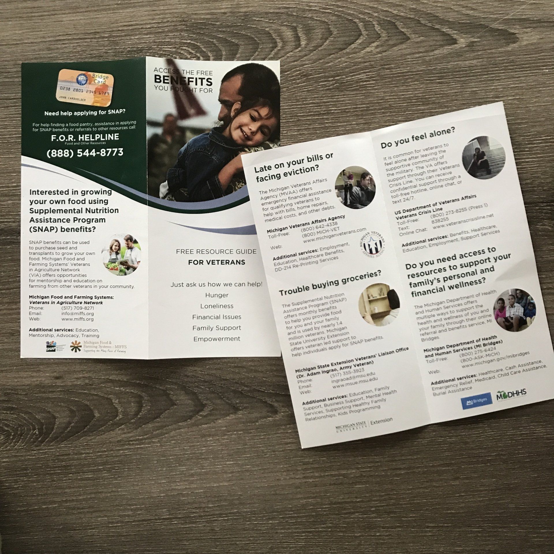 A brochure with a picture of a man holding a child