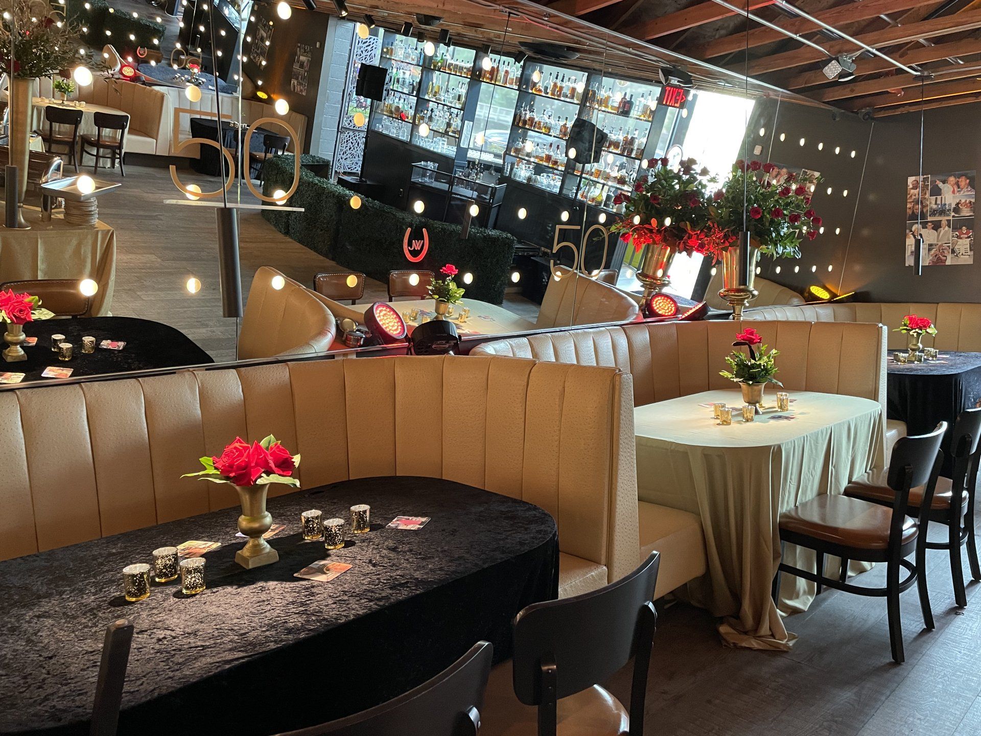 A restaurant with tables and chairs and flowers on them