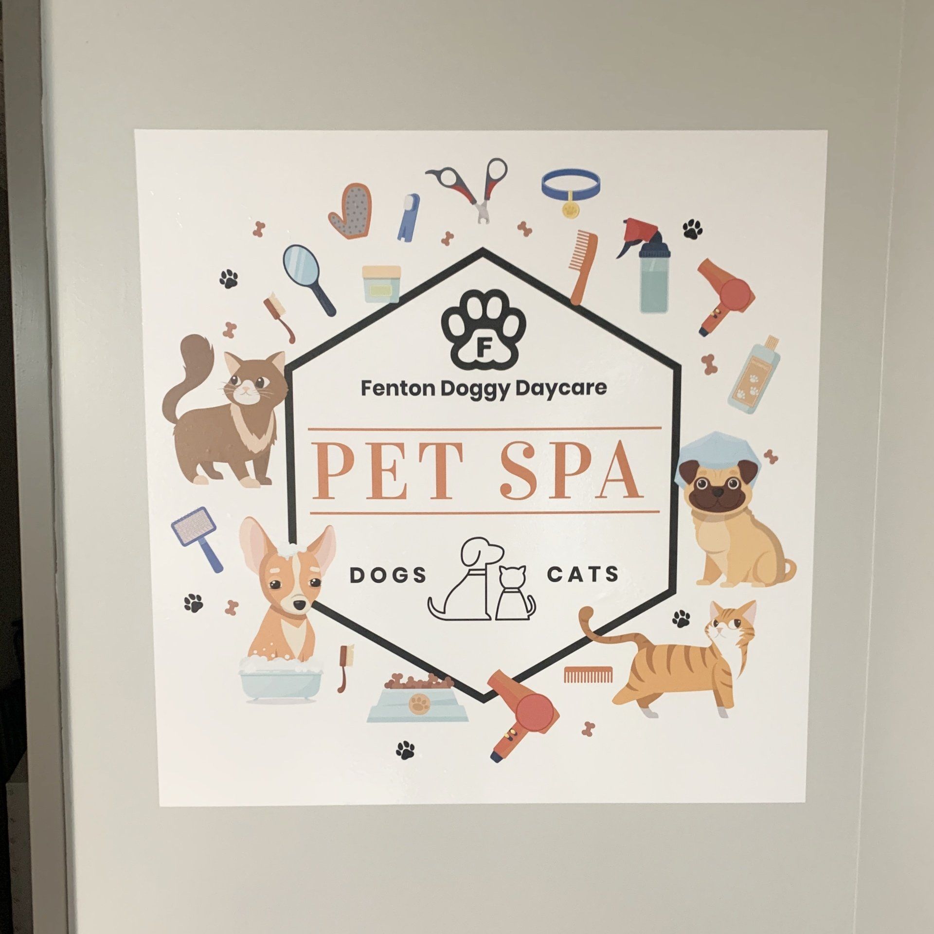 A sign for fenton doggy daycare pet spa