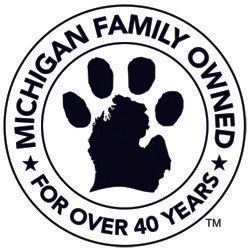 A black and white logo for michigan family owned for over 40 years.
