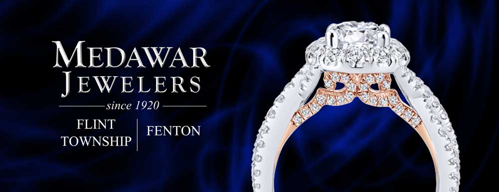A medawar jewelers advertisement with a diamond ring on a blue background.