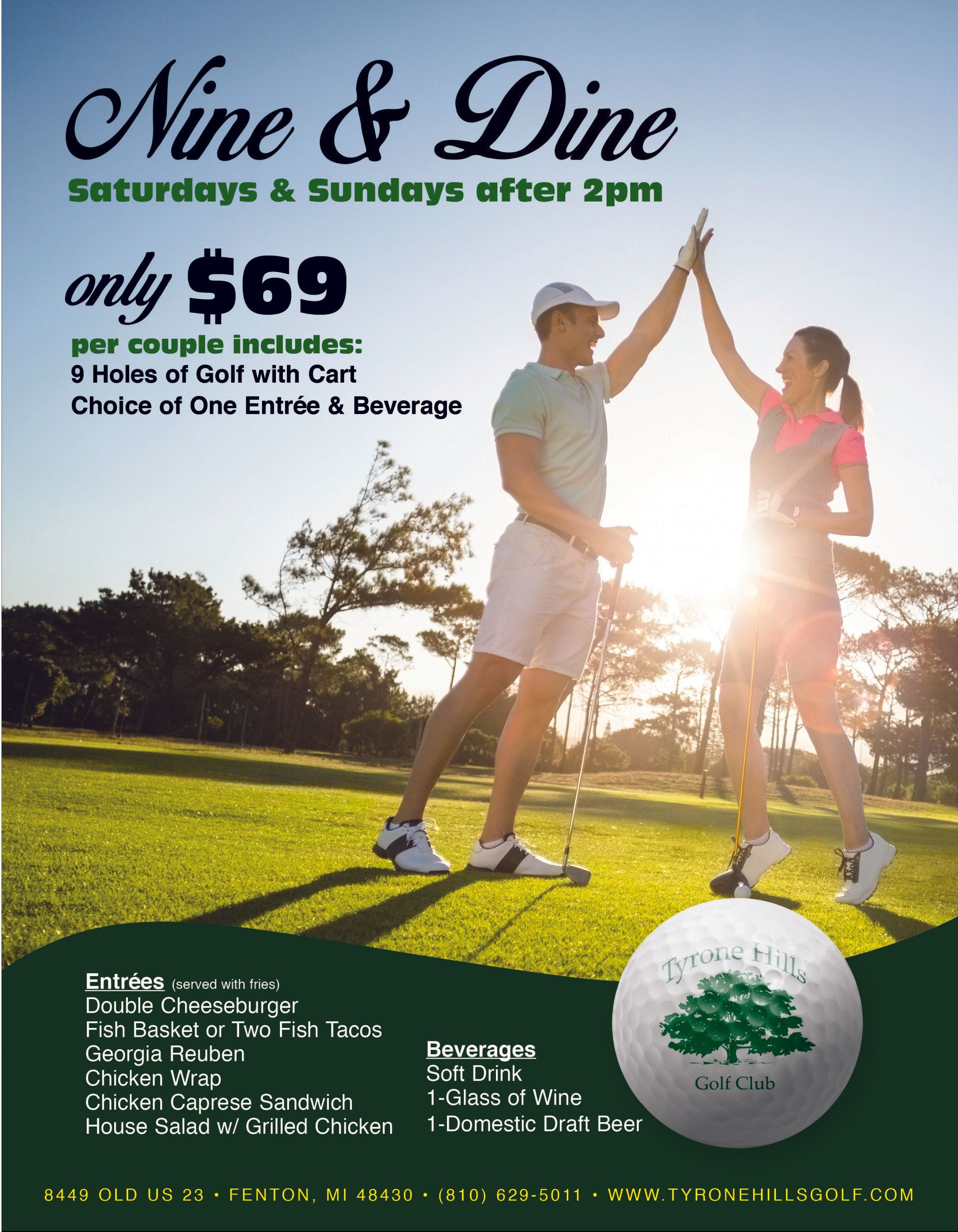 A man and woman giving each other a high five on a golf course