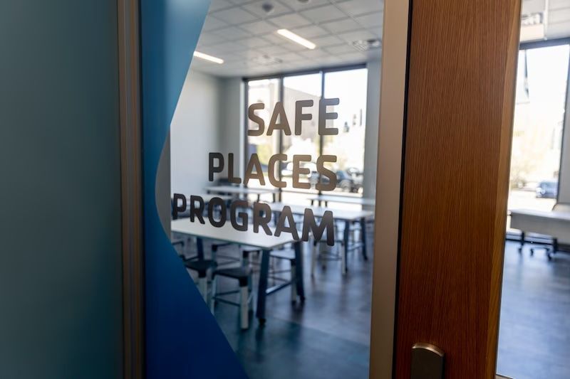 A door with the words `` safe places program '' written on it.
