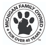 A black and white logo for michigan family owned for over 40 years.