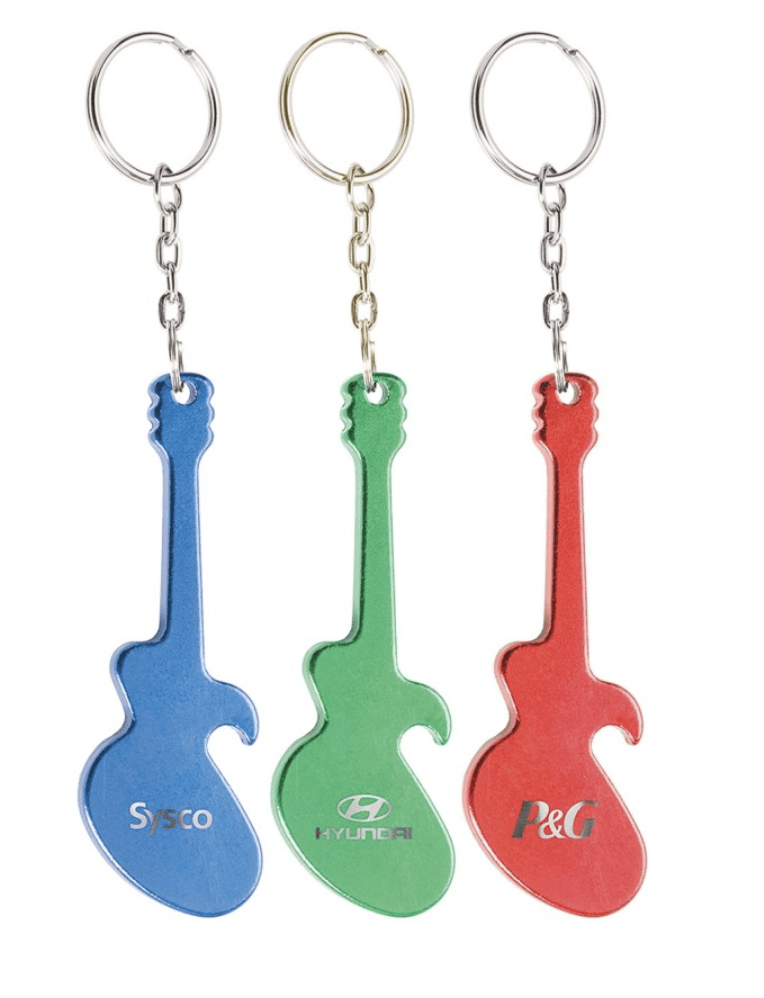 Three keychains in the shape of guitars with logos on them