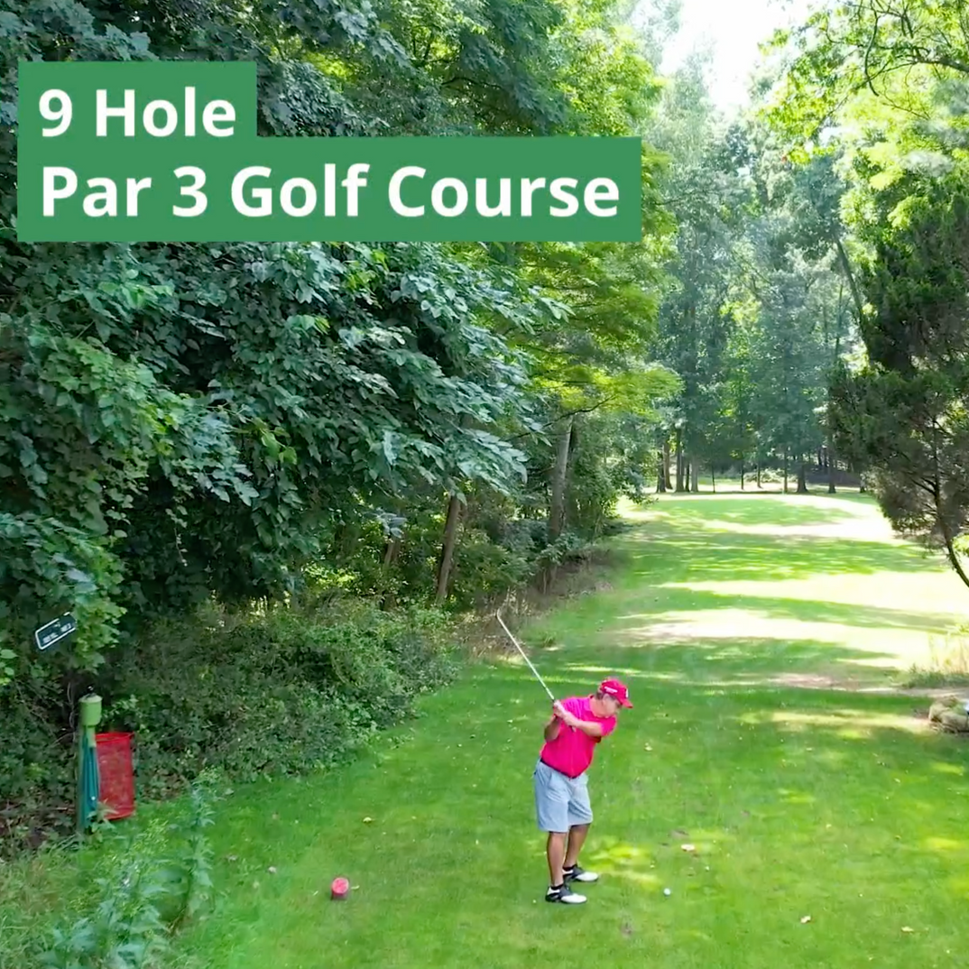 A man is swinging a golf club on a 9 hole par 3 golf course