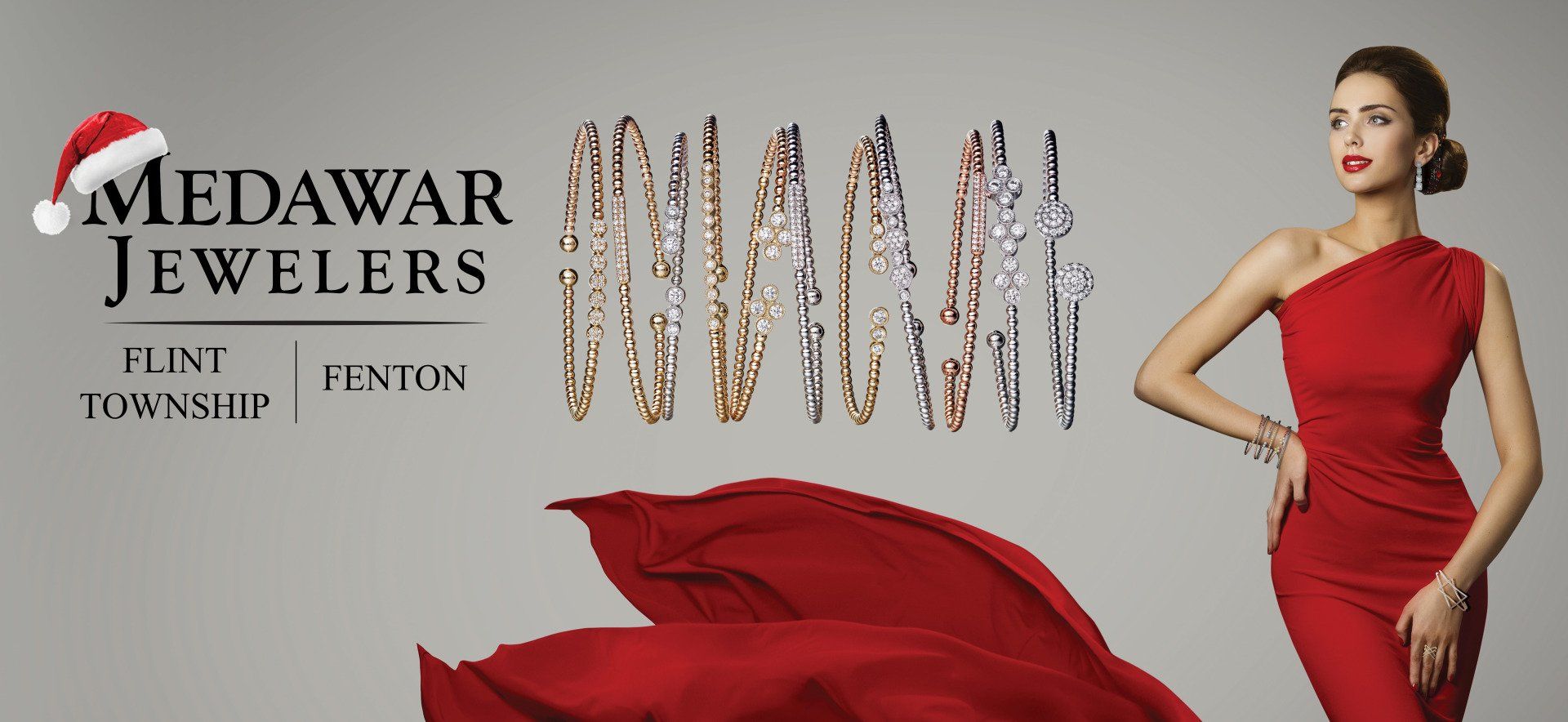 A woman in a red dress is wearing a santa hat.