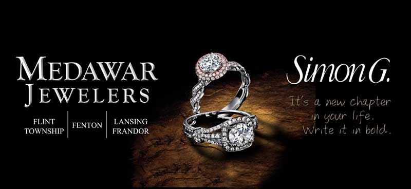 A medawar jewelers ad with two rings on a black background