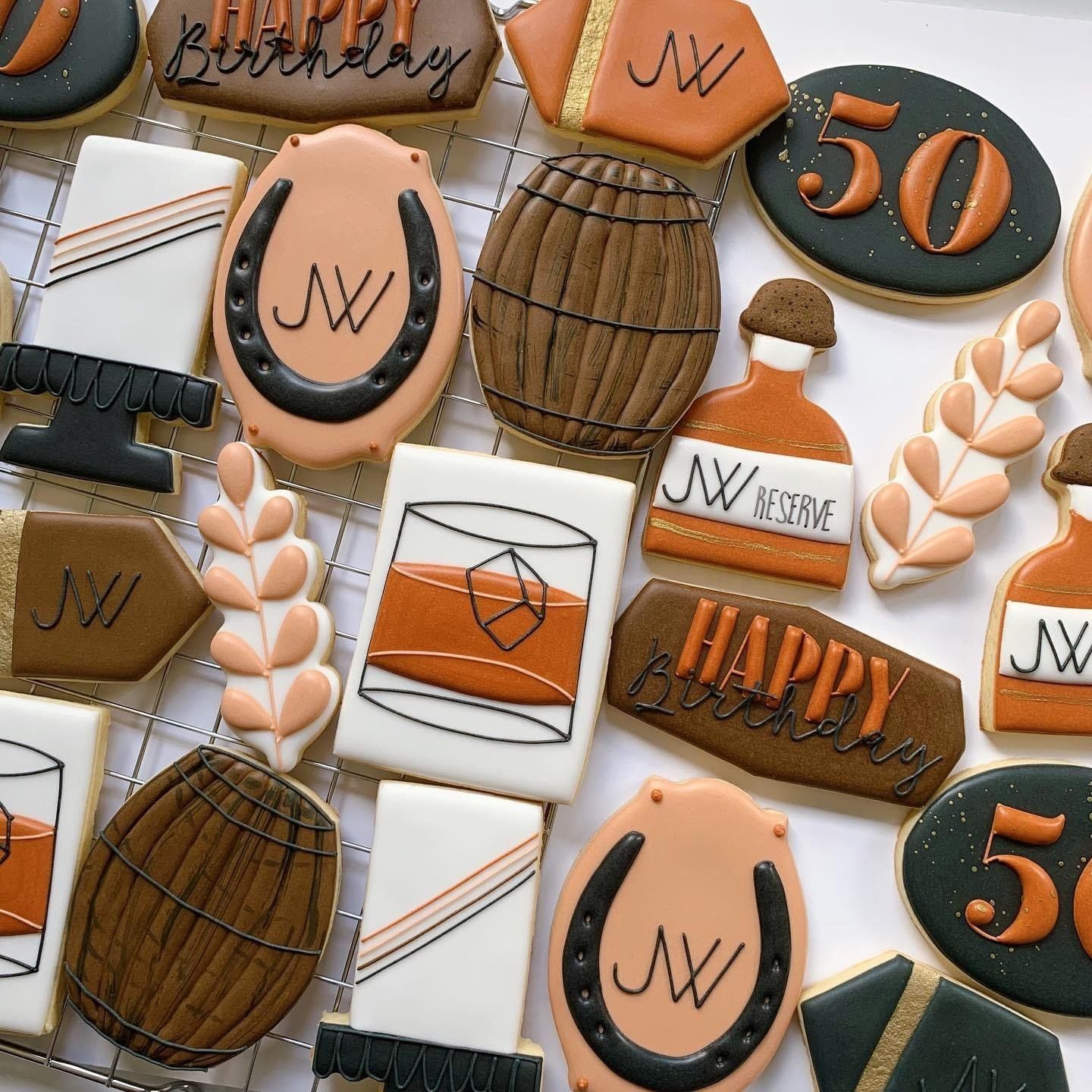 A bunch of cookies with one that says happy birthday