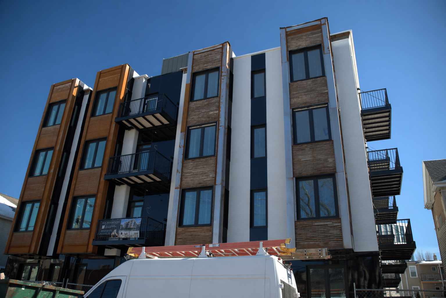 Completed siding installation with decks finished