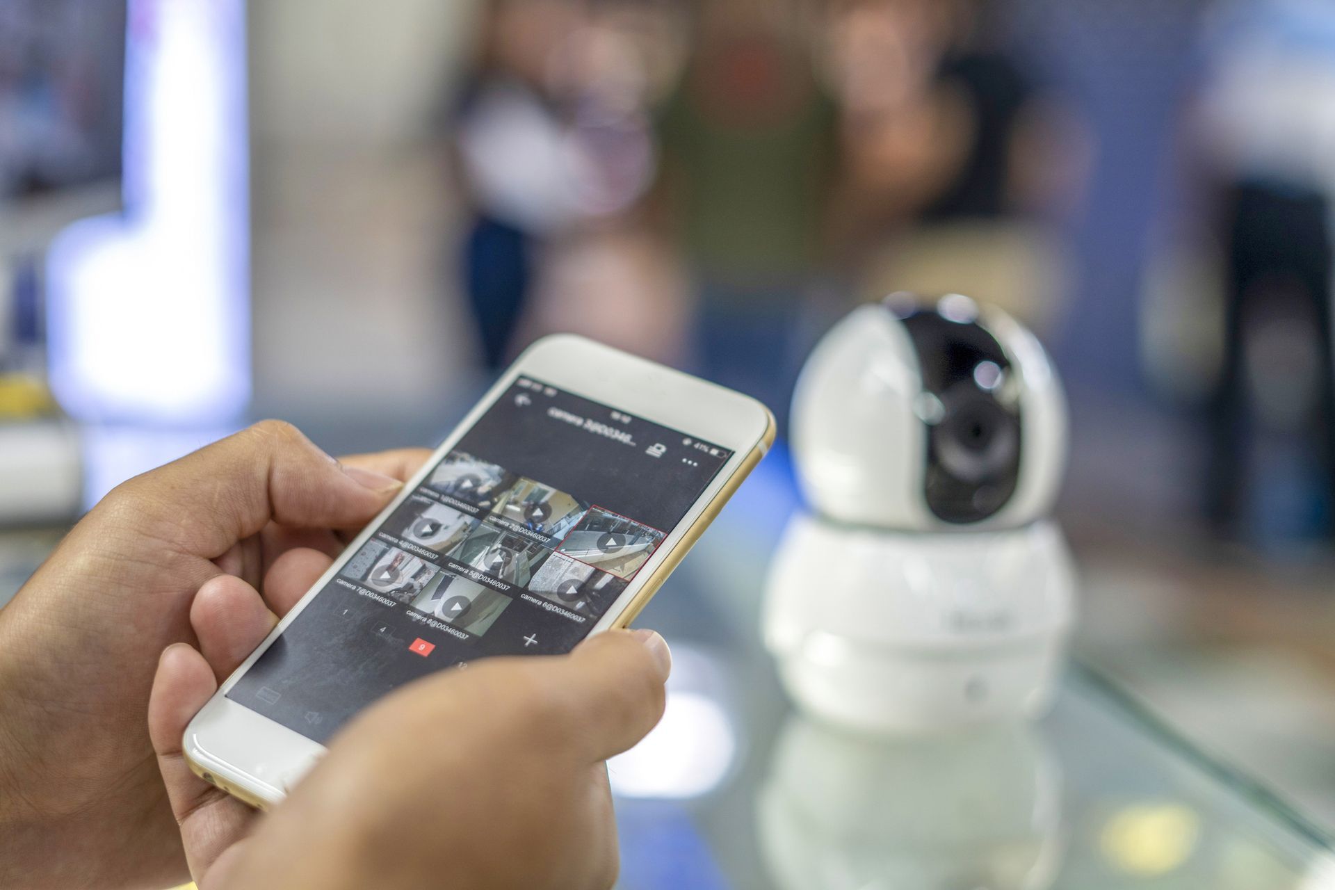 A person is watching the surveillance system from their phone. A person is watching the surveillance system from their phone.
