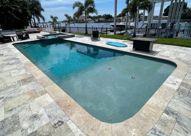 Installed paver pool deck showing layout pattern in Broward County
