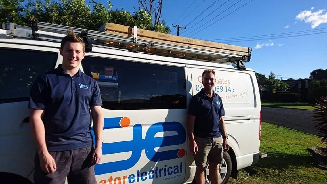 Electricians Standing Next to the Company Van — Electricians in Ballina