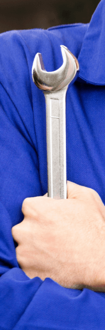 mechanic holding a wrench in a blue uniform
