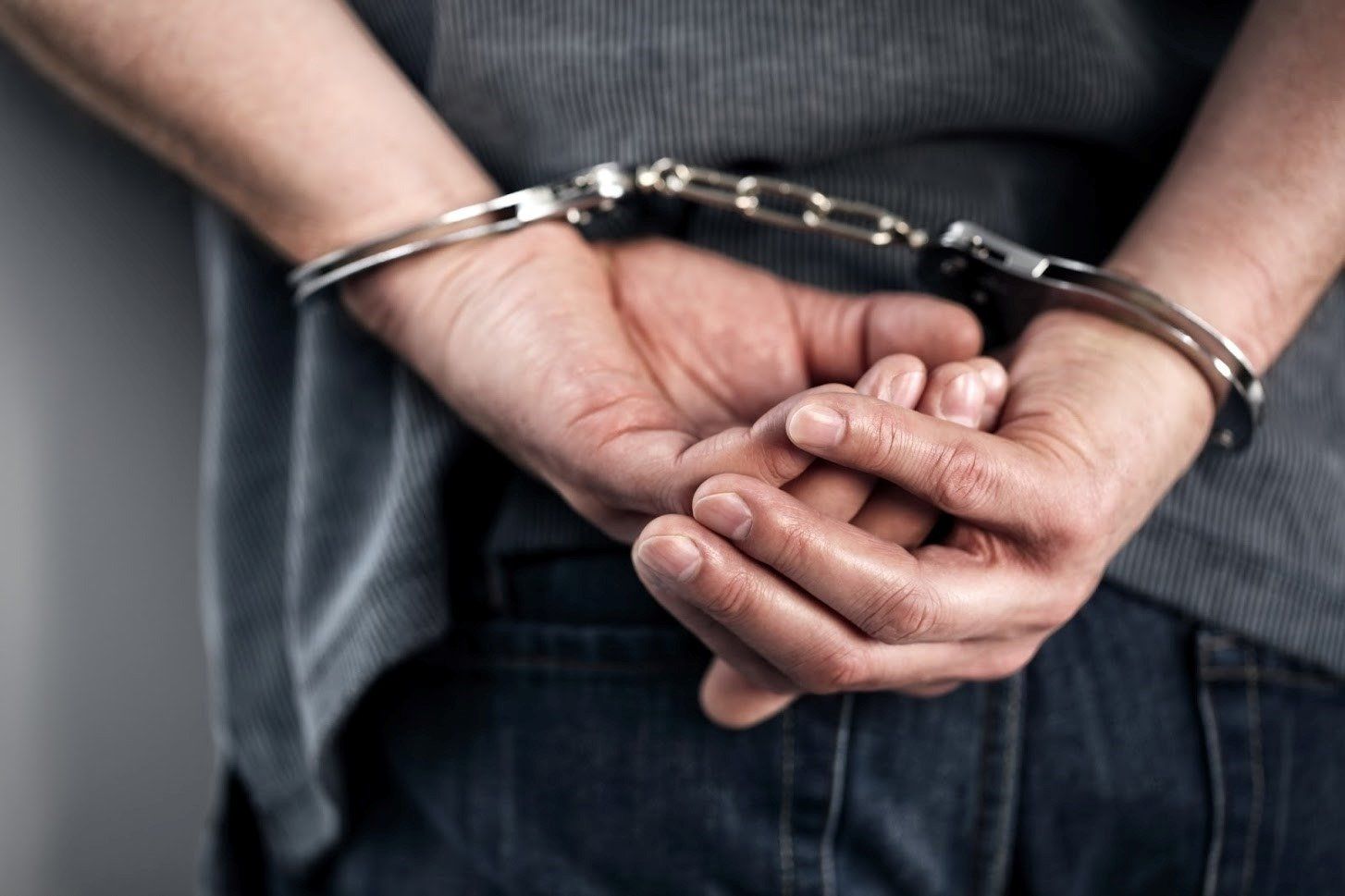 Man In Handcuffs — St. Minneapolis, MN — Absolute Bail Bonds