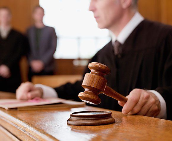 Judge Holding Gavel — St. Minneapolis, MN — Absolute Bail Bonds
